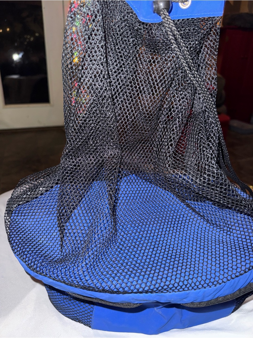 Blue and Black cooler with fishnet storage on top- the original Koozie Brand